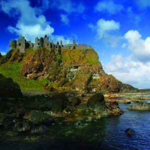 Dunluce Castle is sited dramatically close to the edge of a headland, along the North Antrim coast. Surrounded by jaw dropping coastal scenery, this medieval castle stands where an early Irish fort was once built and where its history can be traced back to early Christians and Vikings.