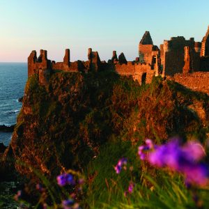 Dunluce Castle is sited dramatically close to the edge of a headland, along the North Antrim coast. Surrounded by jaw dropping coastal scenery, this medieval castle stands where an early Irish fort was once built and where its history can be traced back to early Christians and Vikings. 

Find out more on the Northern Ireland Environment Agency website